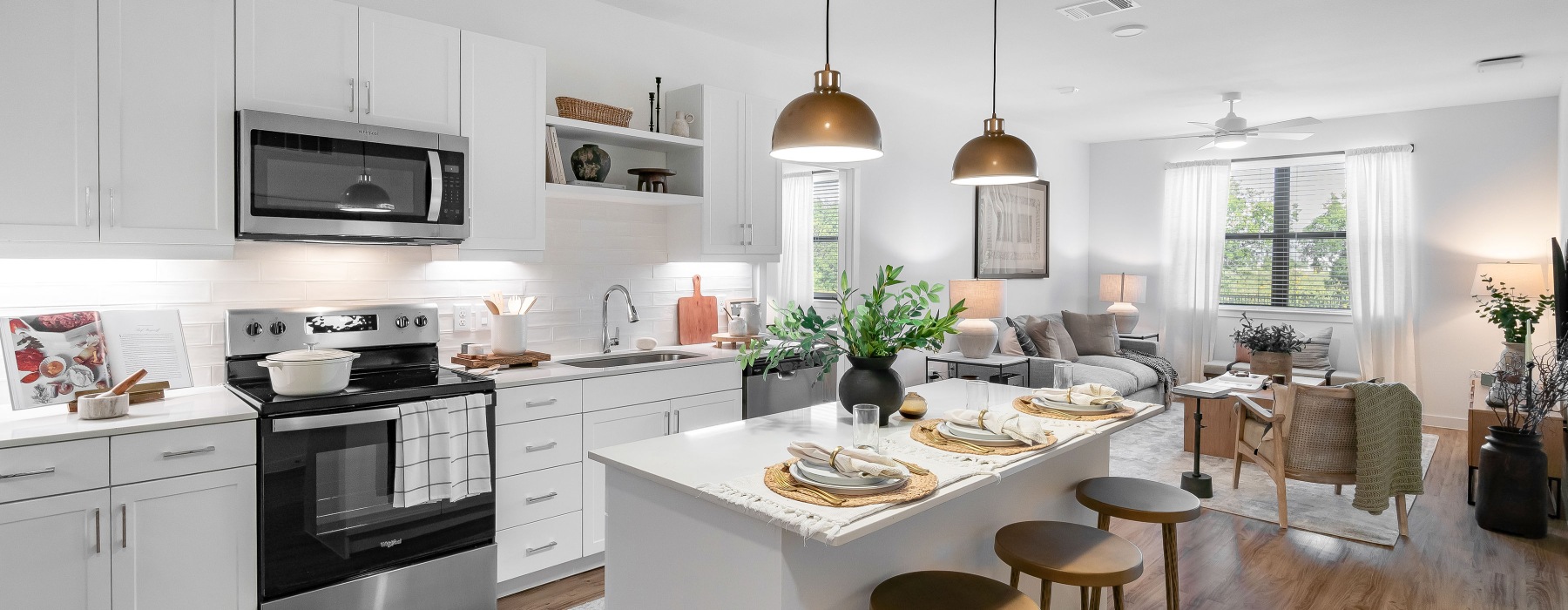 Apartment with white cabinets and gold fixtures